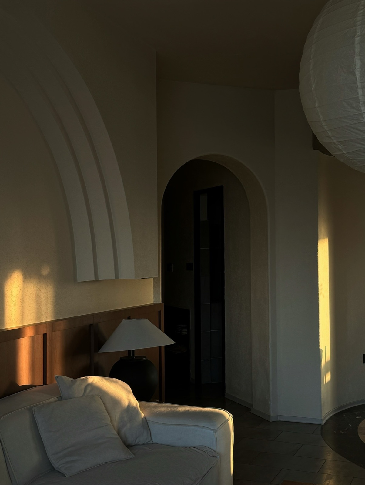Warm wood and curved plaster forms in a Nancy's Home interior
