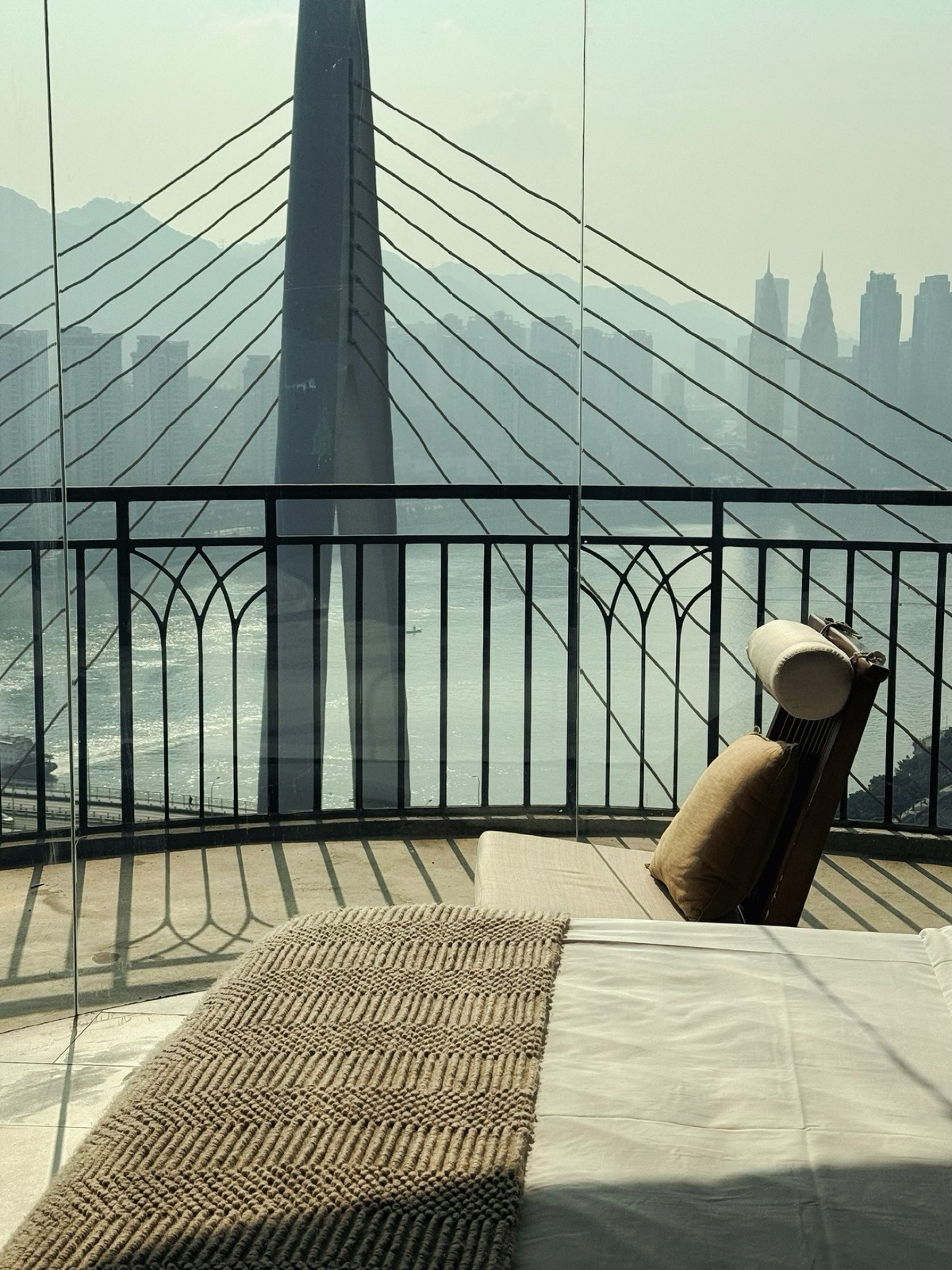 Dongshuimen Bridge seen from a guest room with a chair beside the window