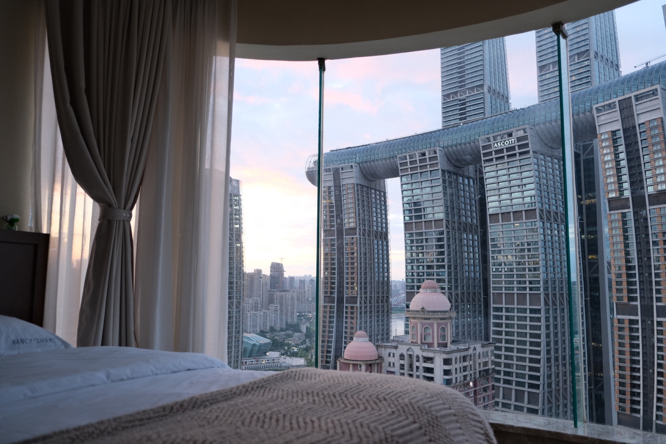 City-view guest room looking toward Raffles City and central Chongqing